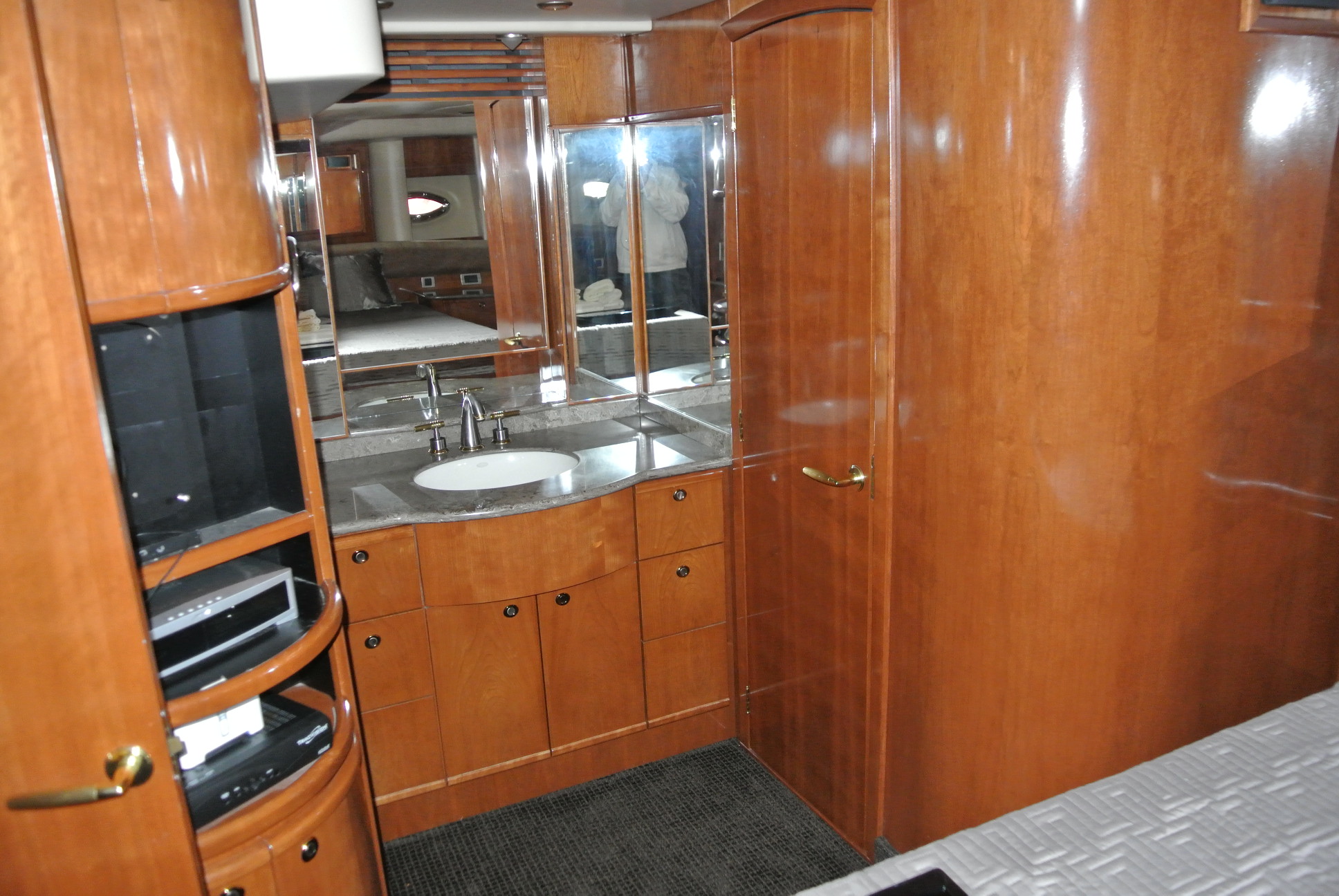 Looking towards the vanity on the starboard side of the stateroom. The head is through that door on the right.